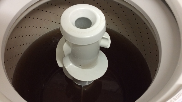 White Rock resident Beverly McLaughlin says the water from her taps, shown here in her washing machine, stayed this dark brown colour for about 10 hours. 