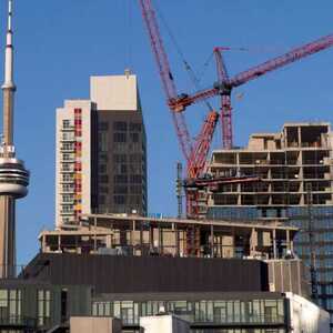 CMHC： 住房成本飙升限制人口流动 多伦多温哥华被点名! 太贵了都不敢来!