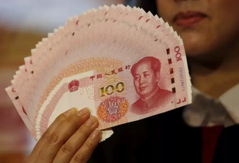 人民币对美元参考汇率达15个月来最高 暗示人行容忍升值