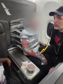 奇观！男子飞机上被绑成麻花 粘座椅上；这也敢说 真是喝大了